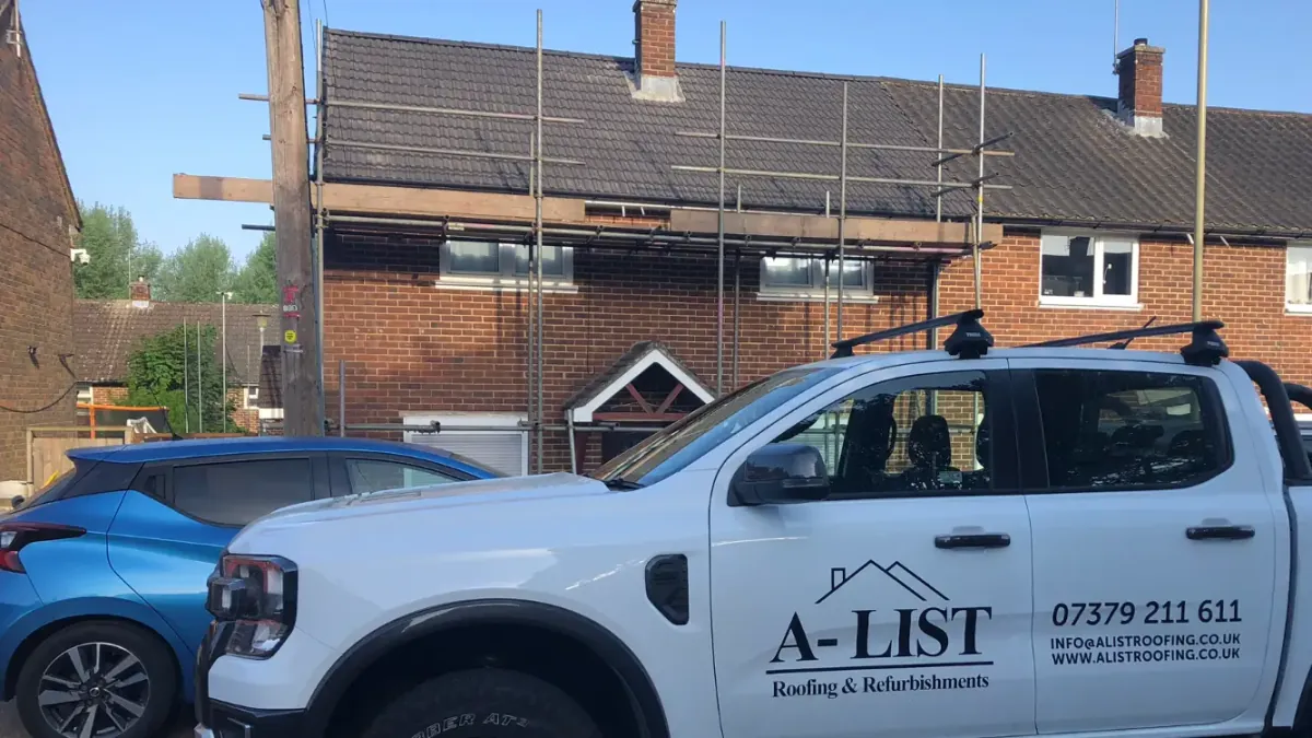 A-List Roofing team replacing roof tiles on a property near Frimley
